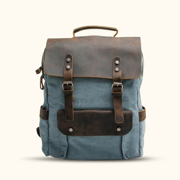 Blue Canvas Laptop Backpack - Carry your laptop and essentials in style with this vibrant blue canvas backpack, perfect for both work and leisure.