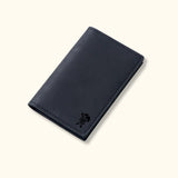 Black genuine leather cardholder with minimalist design and rugged stitching, part of The Rancher's Legacy collection.