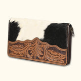 Side view of the Canyon Blossom Leather Wallet, highlighting the detailed leather tooling and hair-on cowhide.