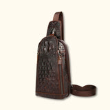 Front angle view of the Croc Ridge Leather Sling Bag - Claw Style, highlighting the detailed crocodile pattern on rich brown leather.