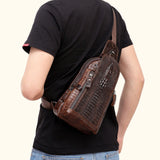 Back view of a model wearing the Croc Ridge Leather Sling Bag - Gator Style, highlighting the intricate crocodile pattern on rich brown leather.