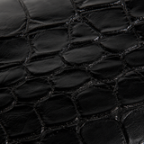 Close-up texture detail of genuine Siamese crocodile leather on The Monarch Crocodile Bifold Wallet in Obsidian Black.