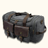 Gray Canvas Duffle Bag: A versatile and durable duffle bag made from sturdy gray canvas material, ideal for various activities including travel, sports, or everyday use.