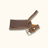 A leather bag tag featuring a classic design, perfect for adding a stylish touch to your favorite bag while providing identification and durability for your travels.