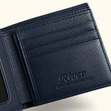 Close-up detail of The Monarch Crocodile Bifold Wallet in Deep Midnight Blue, showcasing the premium leather interior, multiple card slots, embossed River logo, and fine handcrafted stitching.