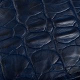 Close-up of The Monarch Crocodile Bifold Wallet in Deep Midnight Blue, highlighting the natural crocodile scale pattern, rich midnight blue finish, and unique texture of genuine crocodile leather craftsmanship.
