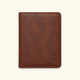 The Western Traveler brown leather passport holder, back view, showing its pebbled leather texture and clean stitched finish.