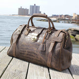 Experience the tactile beauty of croc materials with duffle bags that redefine travel fashion and indulgence.