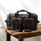 Gray Canvas Duffle Bag: A versatile and robust duffle bag in an elegant gray hue, crafted from durable canvas material, suitable for various purposes, including travel, sports, or everyday use.