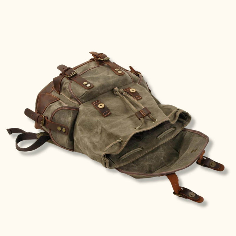 Army Green Waxed Canvas Knapsack - Embrace rugged style and reliable functionality with this army green waxed canvas knapsack, perfect for outdoor enthusiasts and urban explorers alike.