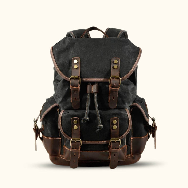 Black Vintage Canvas Backpack - Experience the timeless allure of this black canvas backpack, combining vintage charm with modern functionality for a stylish and practical companion.