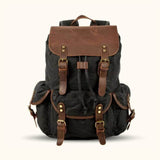 Black Waxed Canvas Leather Backpack - Discover timeless style and durability with this black backpack made from waxed canvas and genuine leather.