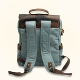 Blue Canvas Leather Laptop Backpack - Blend sophistication with a touch of vibrancy, as this blue canvas backpack with leather accents carries your laptop and essentials in style and durability.