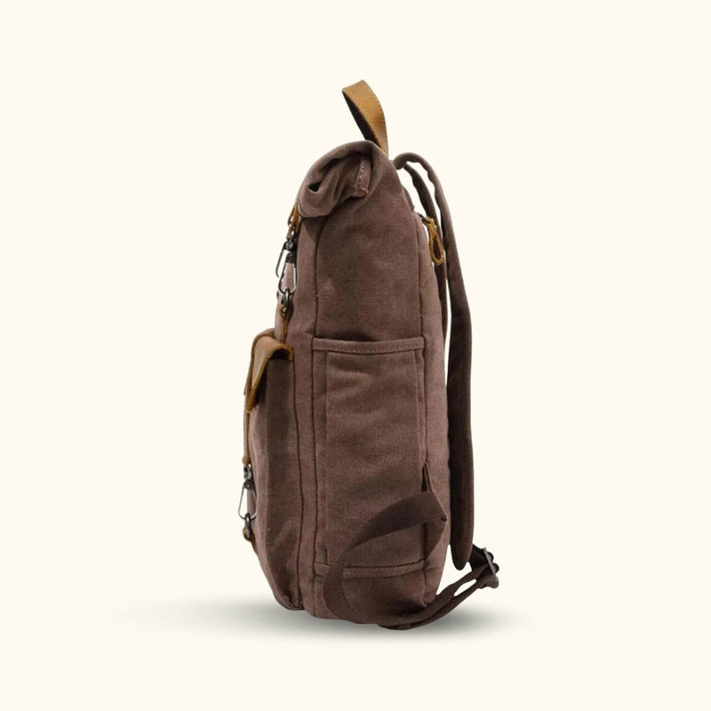 Coffee Canvas Backpack - Savor the rich and stylish essence of this coffee-colored canvas backpack, perfect for carrying your essentials with flair on your daily journeys.
