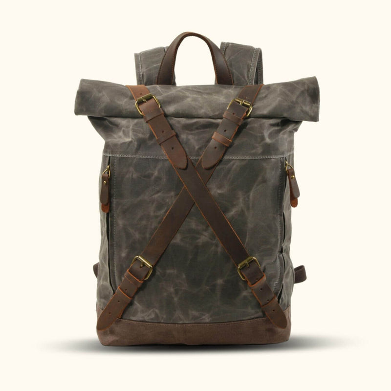 Gray Green Waxed Canvas Rucksack - Discover the perfect blend of style and functionality with this gray green waxed canvas rucksack. Crafted with care, it offers a spacious interior, adjustable straps, and a water-resistant finish. Whether you're exploring the urban jungle or embarking on outdoor escapades, this rucksack is your reliable companion for all your adventures.