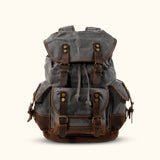 Gray Vintage Canvas Backpack - Carry your essentials in style with this gray-colored vintage canvas backpack, offering a blend of retro charm and modern functionality.
