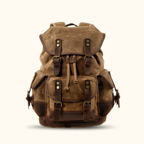 Khaki Vintage Canvas Backpack - Embrace the timeless charm of this khaki-colored vintage canvas backpack, designed to accompany you on all your adventures with style and functionality.lish and practical companion.