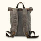 Roll-Top Backpack - Waxed Canvas - Discover the rugged charm of our roll-top backpack crafted with waxed canvas. This versatile backpack features a spacious main compartment, adjustable straps, and a secure roll-top closure. It's designed to withstand the elements and offers reliable functionality for everyday use, outdoor adventures, and travel. Embrace the timeless appeal of waxed canvas with this durable and stylish roll-top backpack.