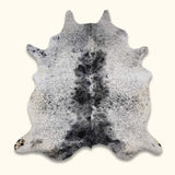 Black and White Texas Range Cowhide Rug with salt and pepper design, perfect for rustic home decor.