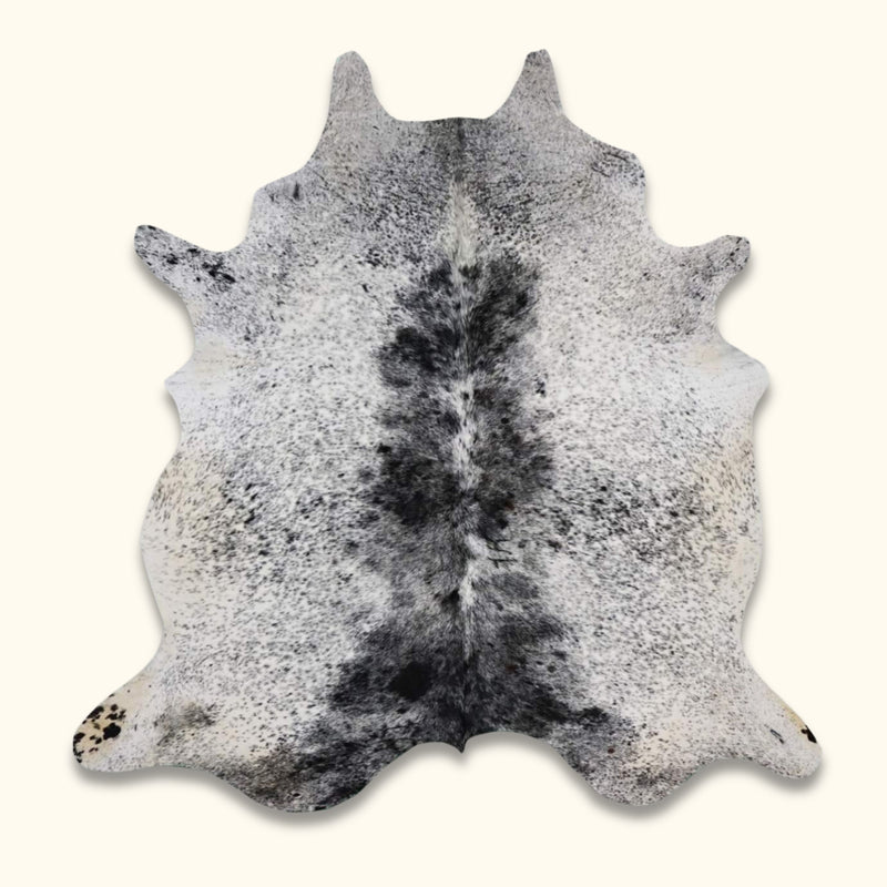 Black and White Texas Range Cowhide Rug with salt and pepper design, perfect for rustic home decor.