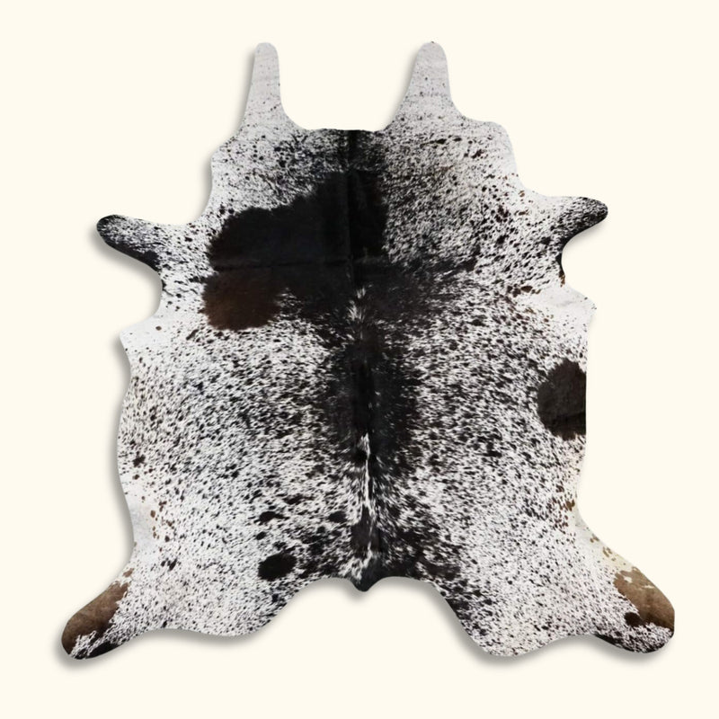Texas Range Salt and Pepper Cowhide Rug in Black and White, featuring a bold natural speckled pattern.