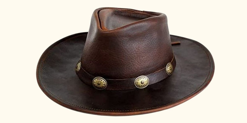 The Walker hat displaying its exceptional features, including the full-grain raging bull leather, shapeable brim, and the distinctive concho band that adds a touch of Western charm.