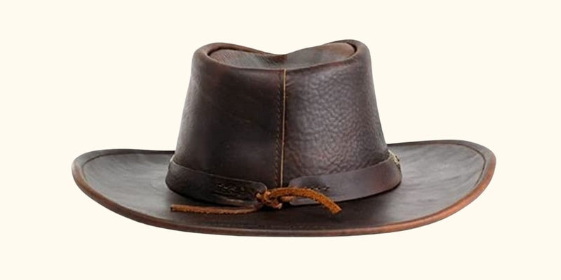 Close-up of the Walker hat's stylish tie-back concho band, showcasing its unique Western charm and intricate craftsmanship.