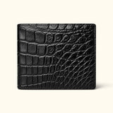 Front view of The Ashford black Siamese crocodile leather bifold wallet with a full-belly exterior and natural luxury scale pattern.