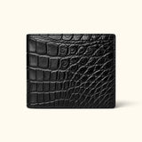 Front view of The Ashford luxury black Siamese crocodile bifold wallet, showcasing its distinctive full-belly scale pattern and refined handcrafted finish.