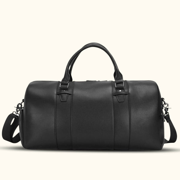 Sleek black leather duffle bag with sturdy handles and a detachable shoulder strap.