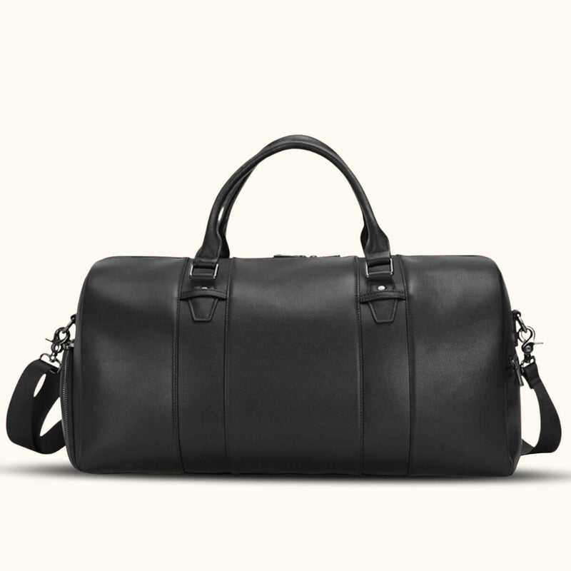 Sleek black leather duffle bag with sturdy handles and a detachable shoulder strap.