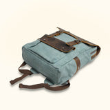 Blue Waxed Canvas Laptop Backpack - Infuse your style with a touch of resilience, as this blue waxed canvas backpack ensures the safety and convenience of carrying your laptop and essentials.