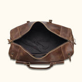 Experience timeless elegance with a brown leather duffle bag, your versatile and sophisticated travel partner.