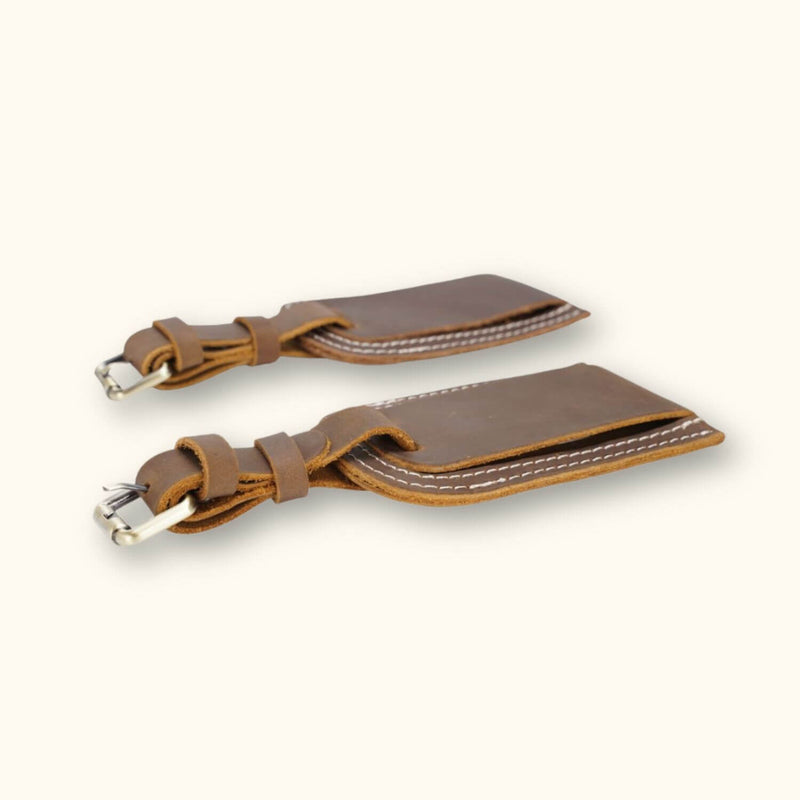 A collection of brown leather tags, showcasing their timeless elegance and durability, ideal for adding a touch of sophistication to your belongings.