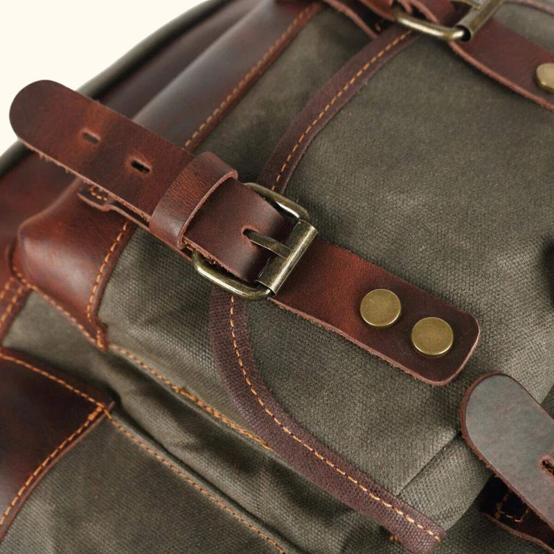 Canvas Backpack with Leather Accents - Embrace a fusion of style and durability with this canvas backpack featuring genuine leather accents. Designed to withstand the rigors of everyday use, it offers a perfect blend of functionality and fashion for your daily adventures.