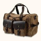 Canvas Weekender Bag: A stylish and spacious bag made from durable canvas, perfect for weekend getaways and short trips, offering ample storage and style for your travel essentials.