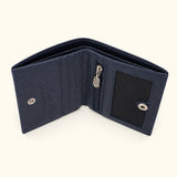 Top construction view of The Compact Crocodile Wallet in Deep Navy showing the bifold structure and two cash compartments