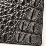 Close-up of The Compact Crocodile Wallet in Graphite Gray showing natural crocodile scale texture and hand-finished stitching