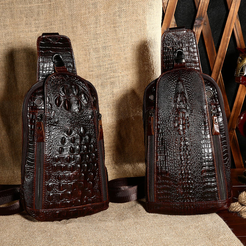Display of the Croc Ridge Leather Sling Bag in both Claw Style and Gator Style, featuring rich brown leather with distinctive crocodile patterns, set against a rustic background.