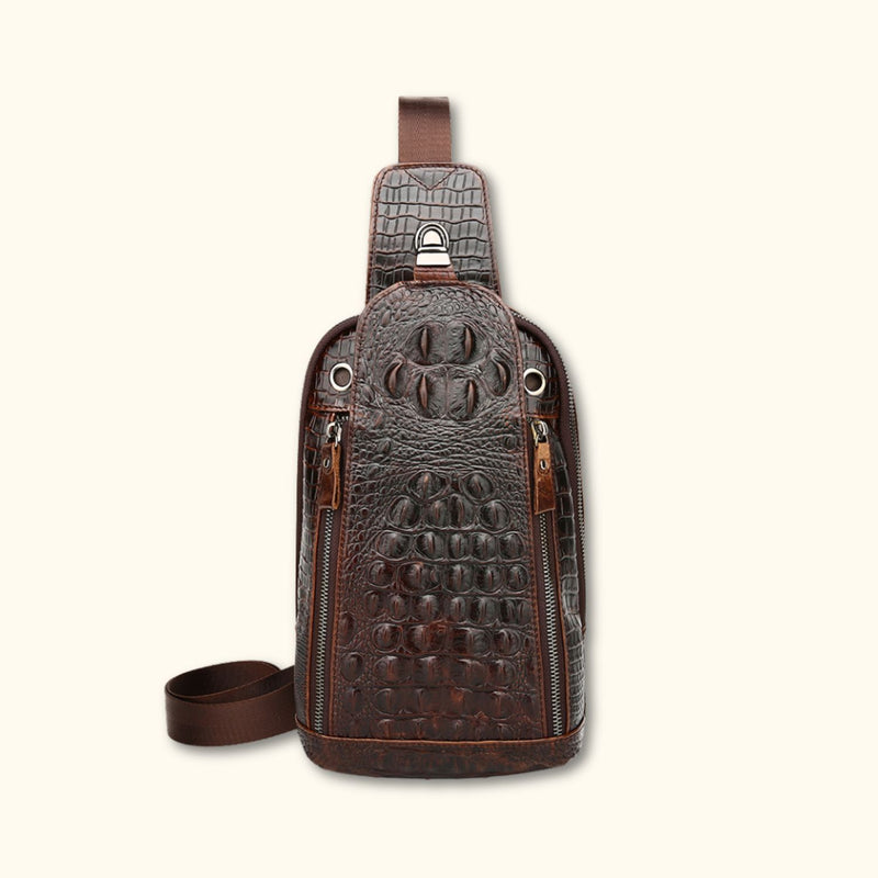 Front view of the Croc Ridge Leather Sling Bag - Claw Style, featuring the detailed crocodile pattern on rich brown leather with dual zipper compartments.
