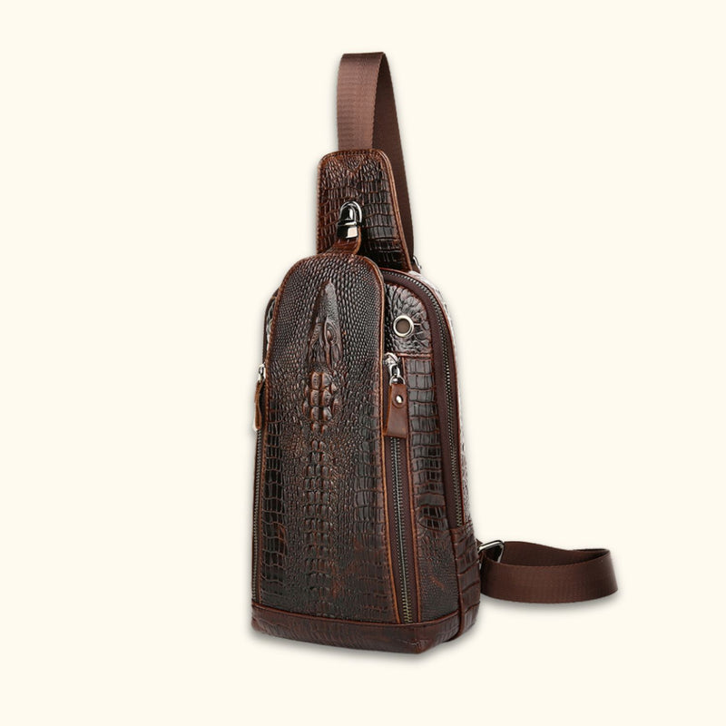 Front angle view of the Croc Ridge Leather Sling Bag - Gator Style, showcasing the intricate crocodile pattern on rich brown leather.