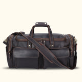 Sophisticated dark brown leather duffle bag, ideal for both casual outings and professional travel, boasting a classic design with durable construction and spacious compartments.