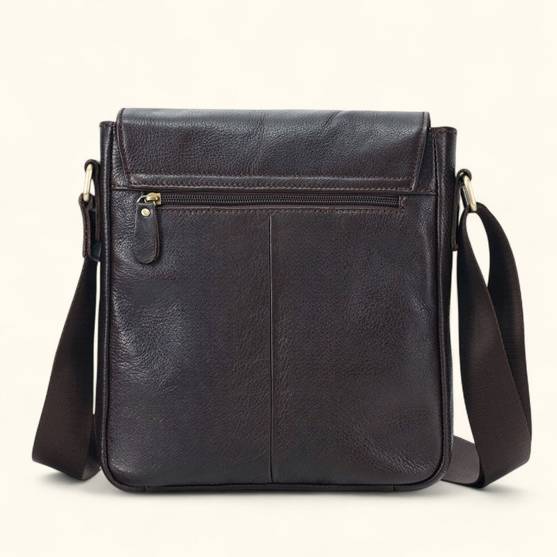 Back view of The Dustwalker full-grain cow leather crossbody iPad bag featuring rear zipper pocket and adjustable shoulder strap.