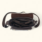 Top view of The Dustwalker full-grain cow leather crossbody iPad bag opened to show multiple compartments, zipper pocket, and small organizer pockets.