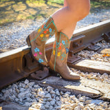 Lifestyle image of a woman wearing the Flutterfly Ladies Western Boots