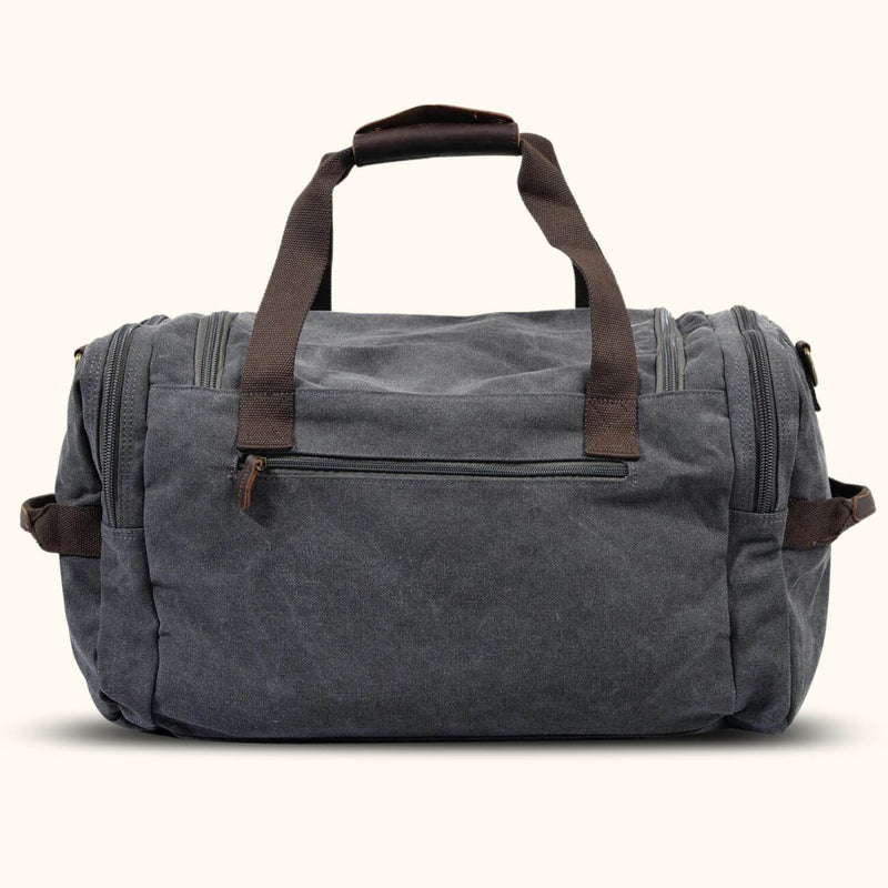 Gray Canvas Bag: A versatile bag crafted from durable gray canvas material, suitable for various purposes such as shopping, carrying personal items, or as a fashion accessory.