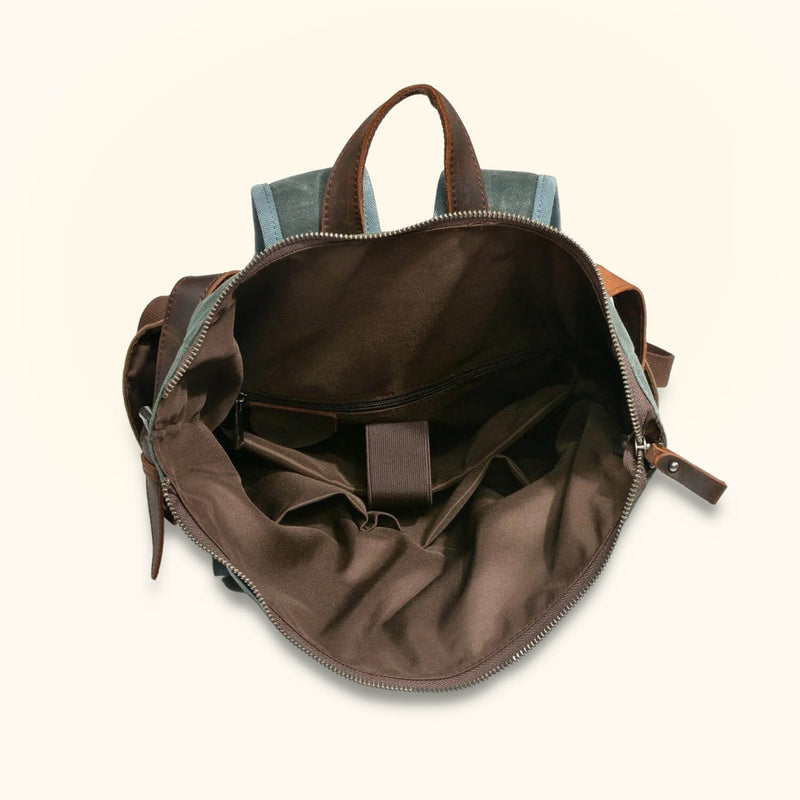 Laptop Roll-Top Canvas Backpack - A perfect blend of practicality and style, this backpack is designed to carry your laptop securely while offering the convenience of a roll-top closure.