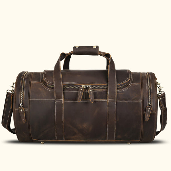 Sophisticated leather barrel bag: a stylish travel companion.