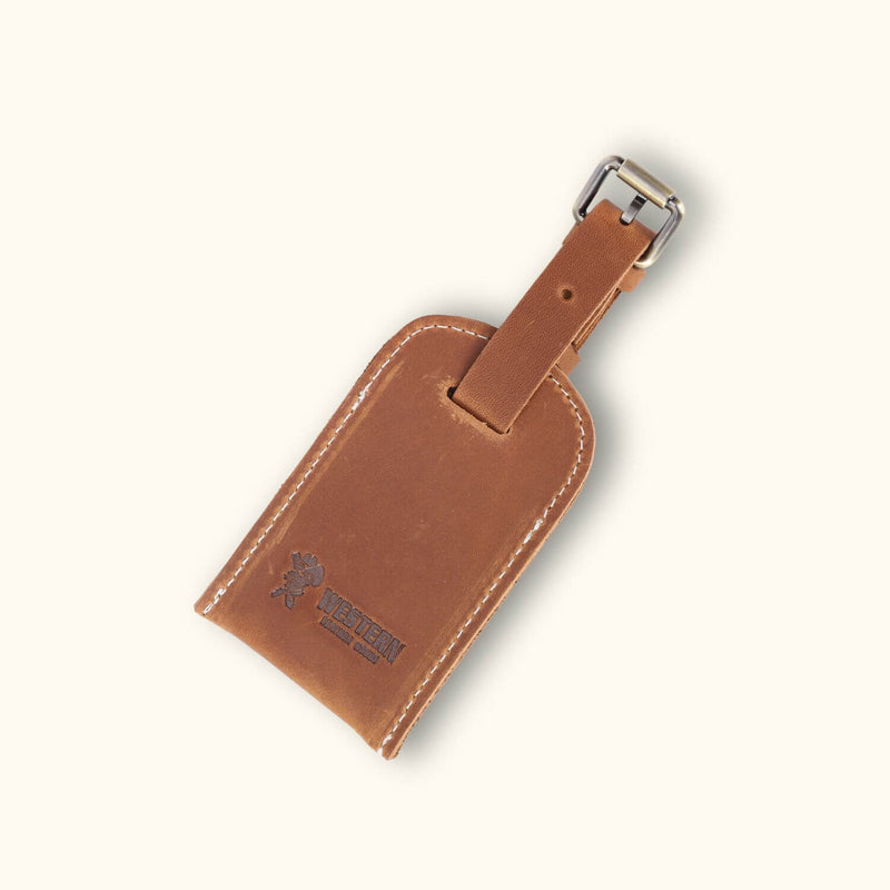 A leather luggage tag featuring a sleek design with a smooth surface and sturdy construction, ideal for adding style and durability to your travel accessories.