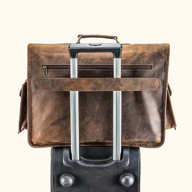 Leather Satchel Bag: Briefcase atop suitcase, secured with trolley strap.